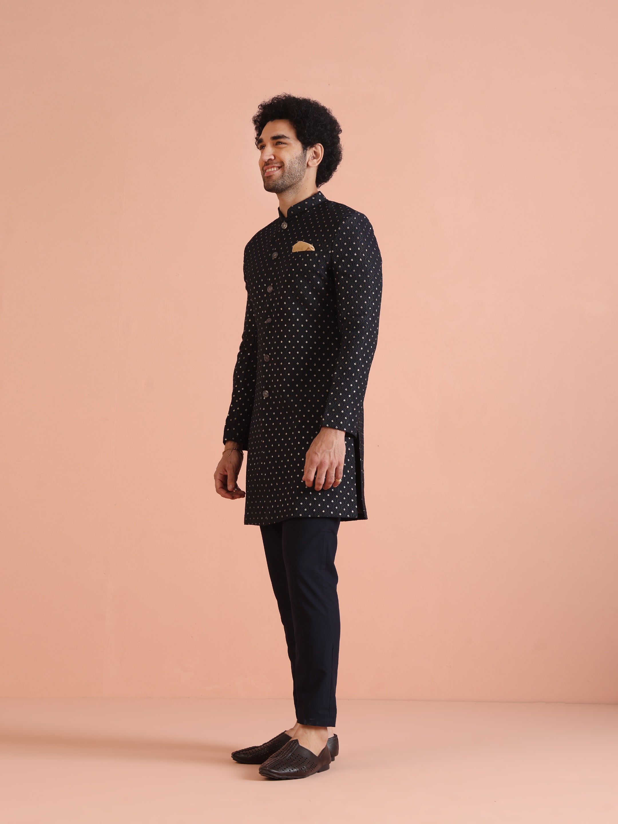 Shown here is the model in a side profile, wearing Kisah’s navy blue embellished Indo-Western trouser set