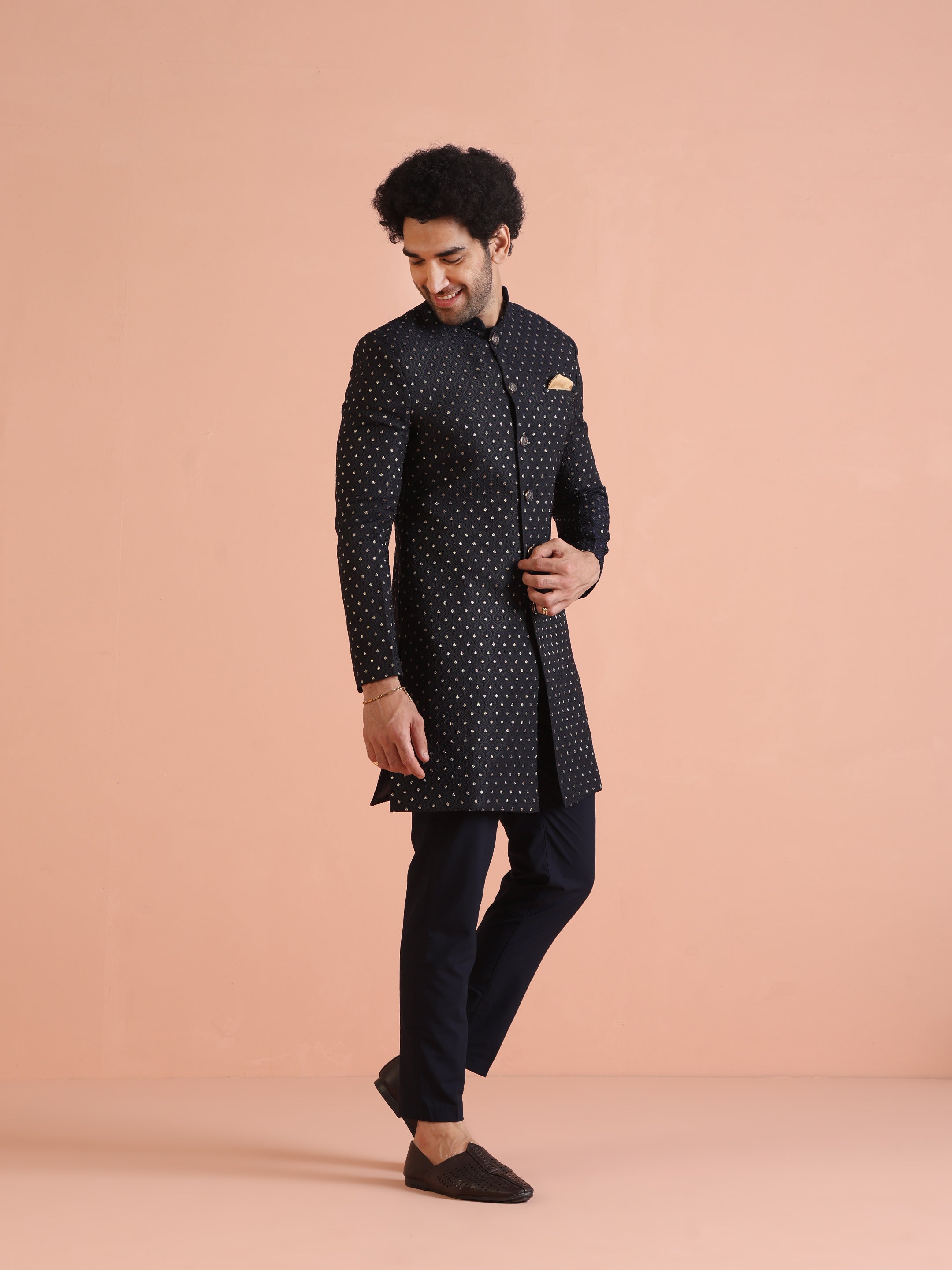 The model is elegantly flaunting Kisahâ€™s navy blue embellished Indo-Western trouser set with poise