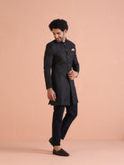 The model is elegantly flaunting Kisahâ€™s navy blue embellished Indo-Western trouser set with poise