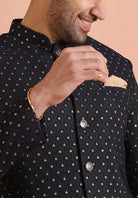 A detailed close-up reveals the fine embellishments adorning Kisahâ€™s navy blue embellished Indo-Western trouser set