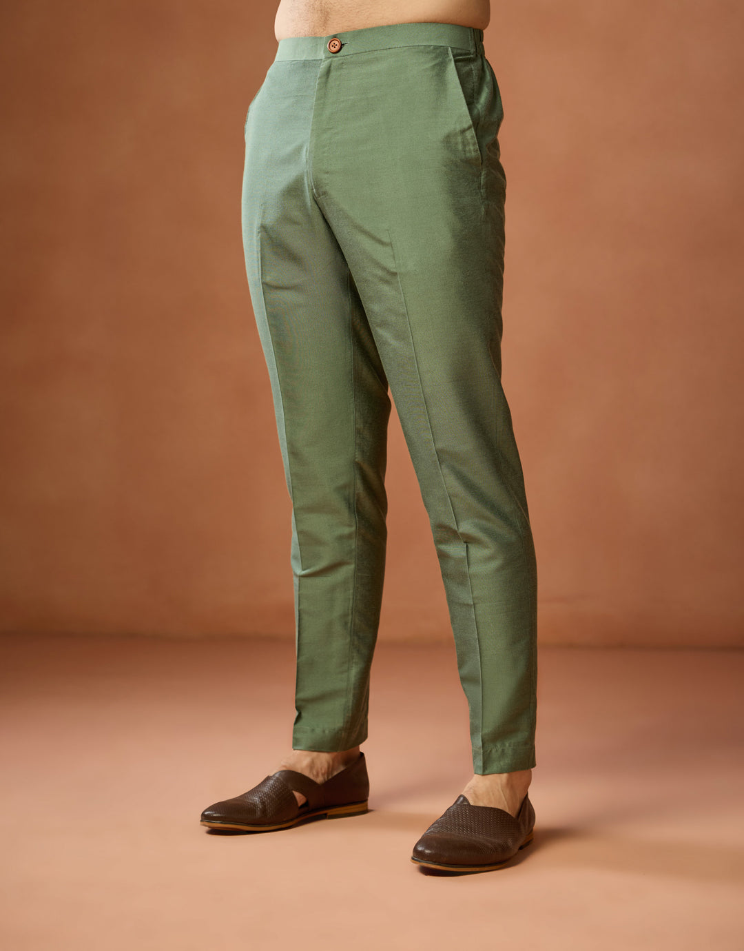 The green trouser for Kisah's Green silk blend floral embroidered kurta is in the image