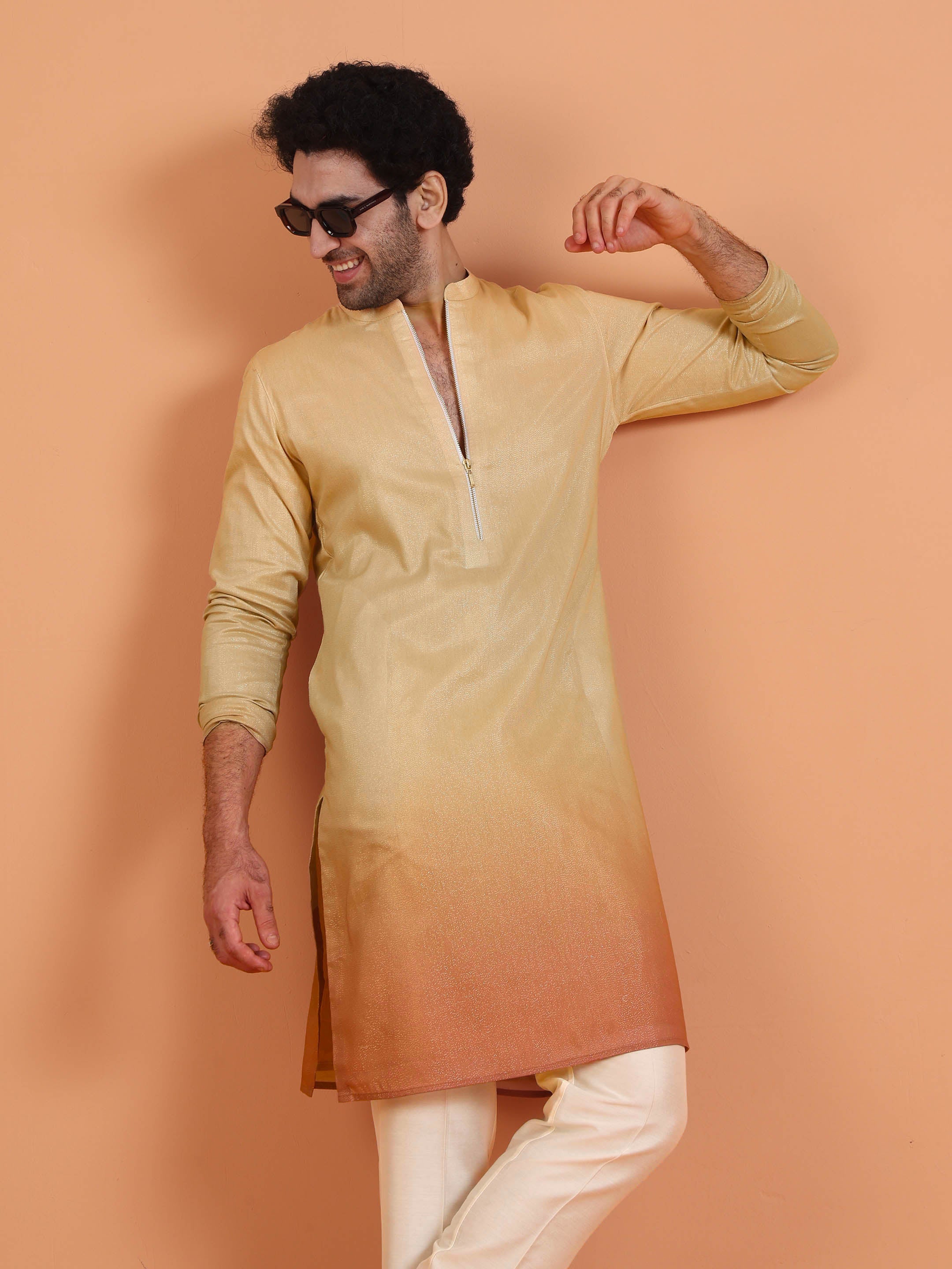 Keeping his hand side, the model is posing with Kisah's Beige Ombre Kurta Zip Set with Dupatta 
