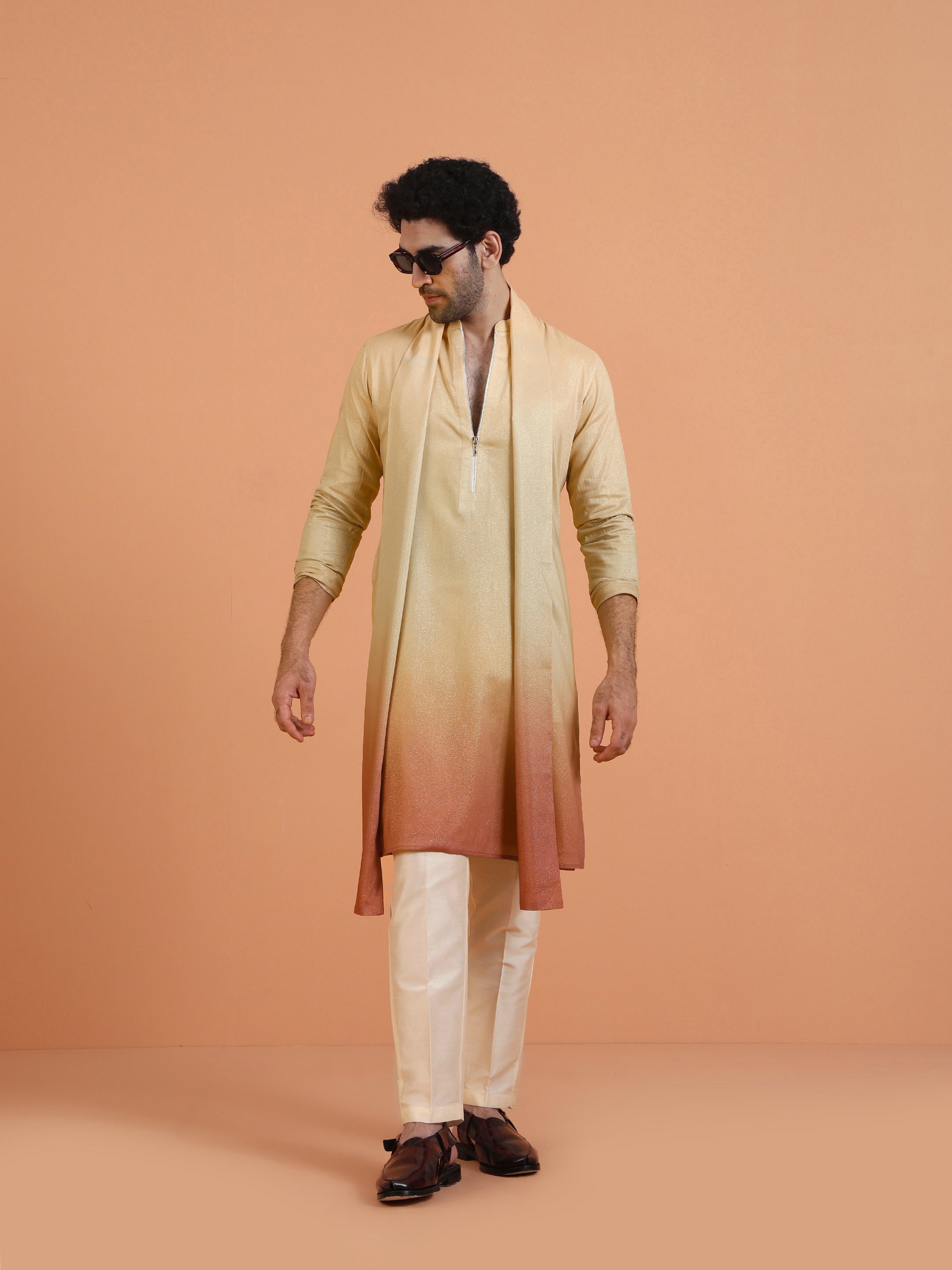 The model with sunglass is posing stylishly with  Beige Ombre Kurta Zip Set with Dupatta of Kisah