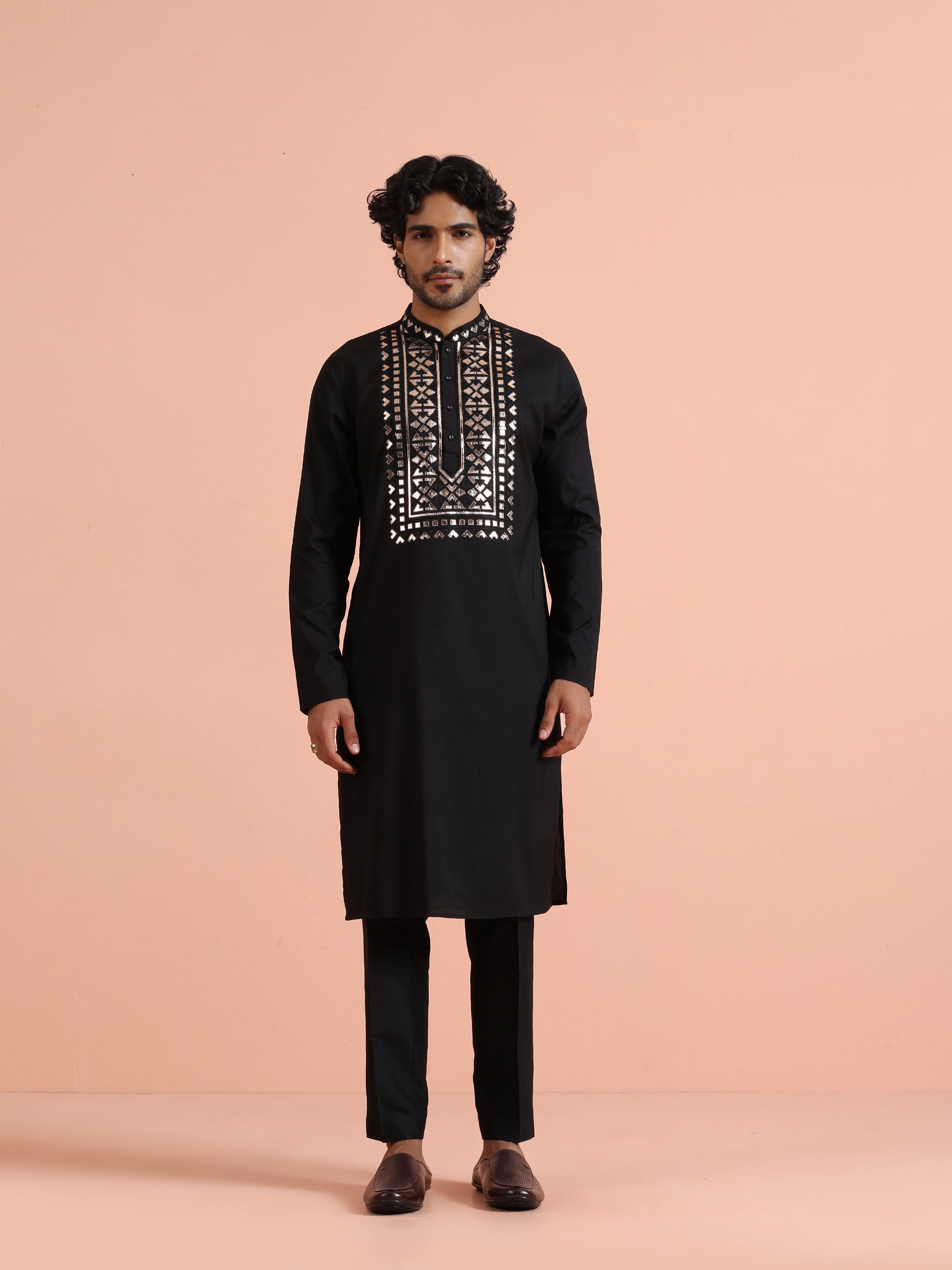 The man is standing, looking forward with Black Metallic Embroidered Kurta Set