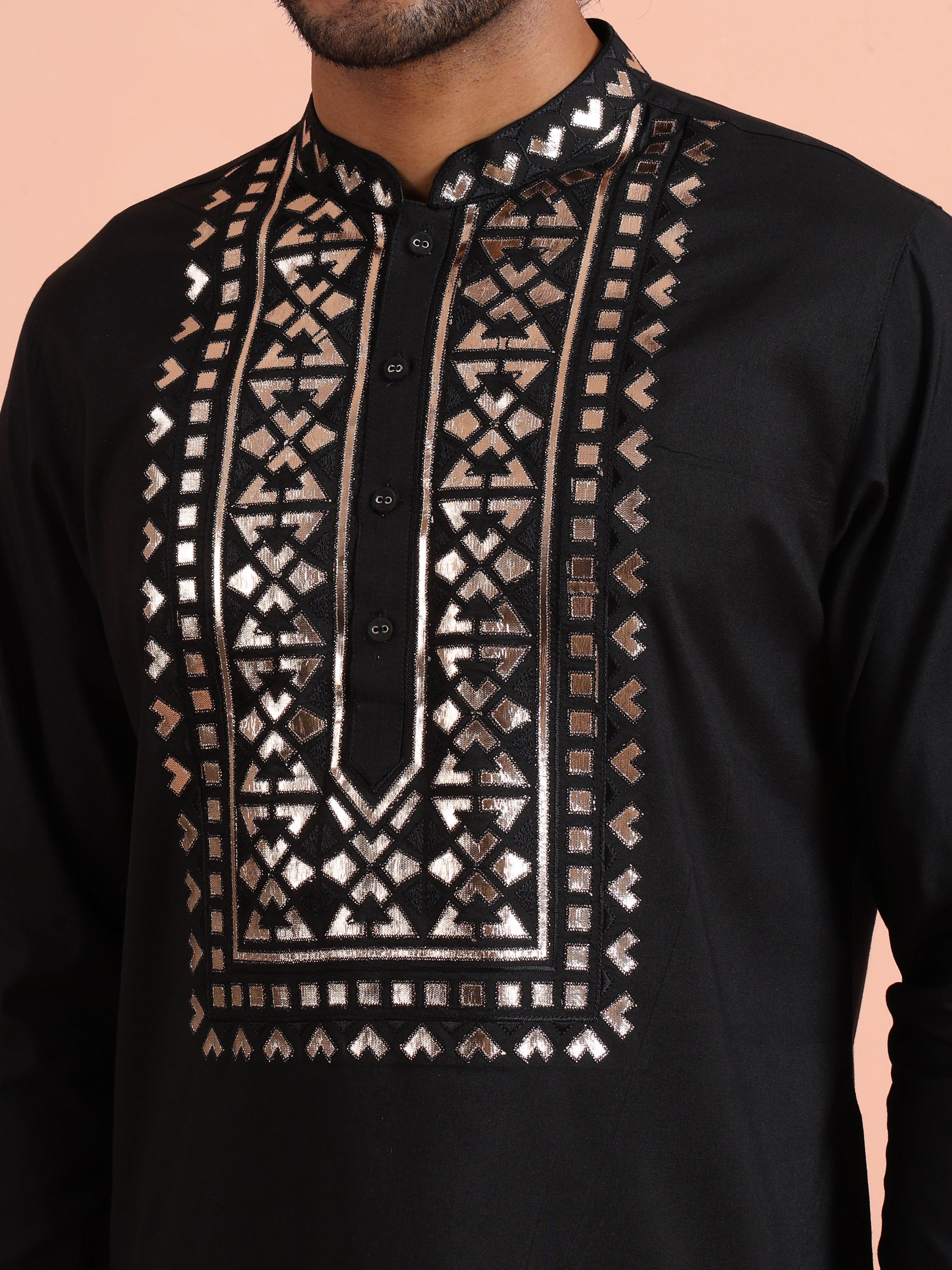 The designer geometric motifs of Black Metallic Embroidered Kurta Set are highlighted